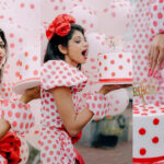 Shruti's birthday celebration is the same with the dress, cake, and balloons.